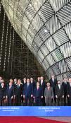 Group photo of political leaders in Brussels interior. 