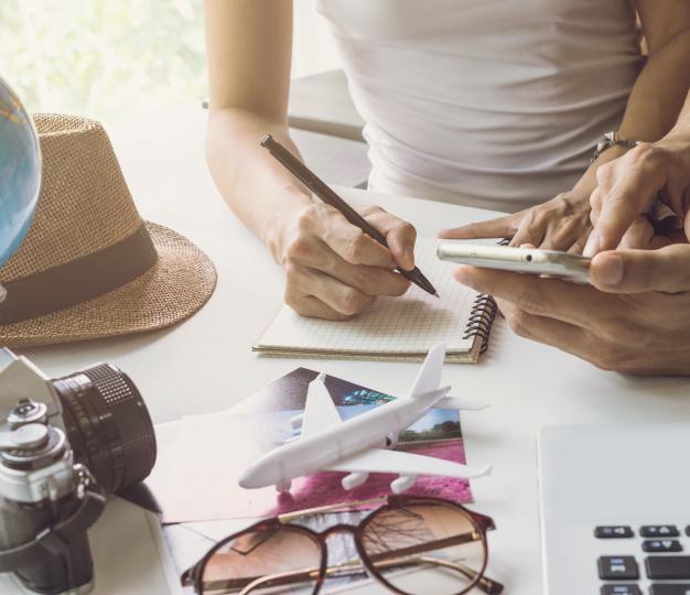 Young couple planning vacation trip